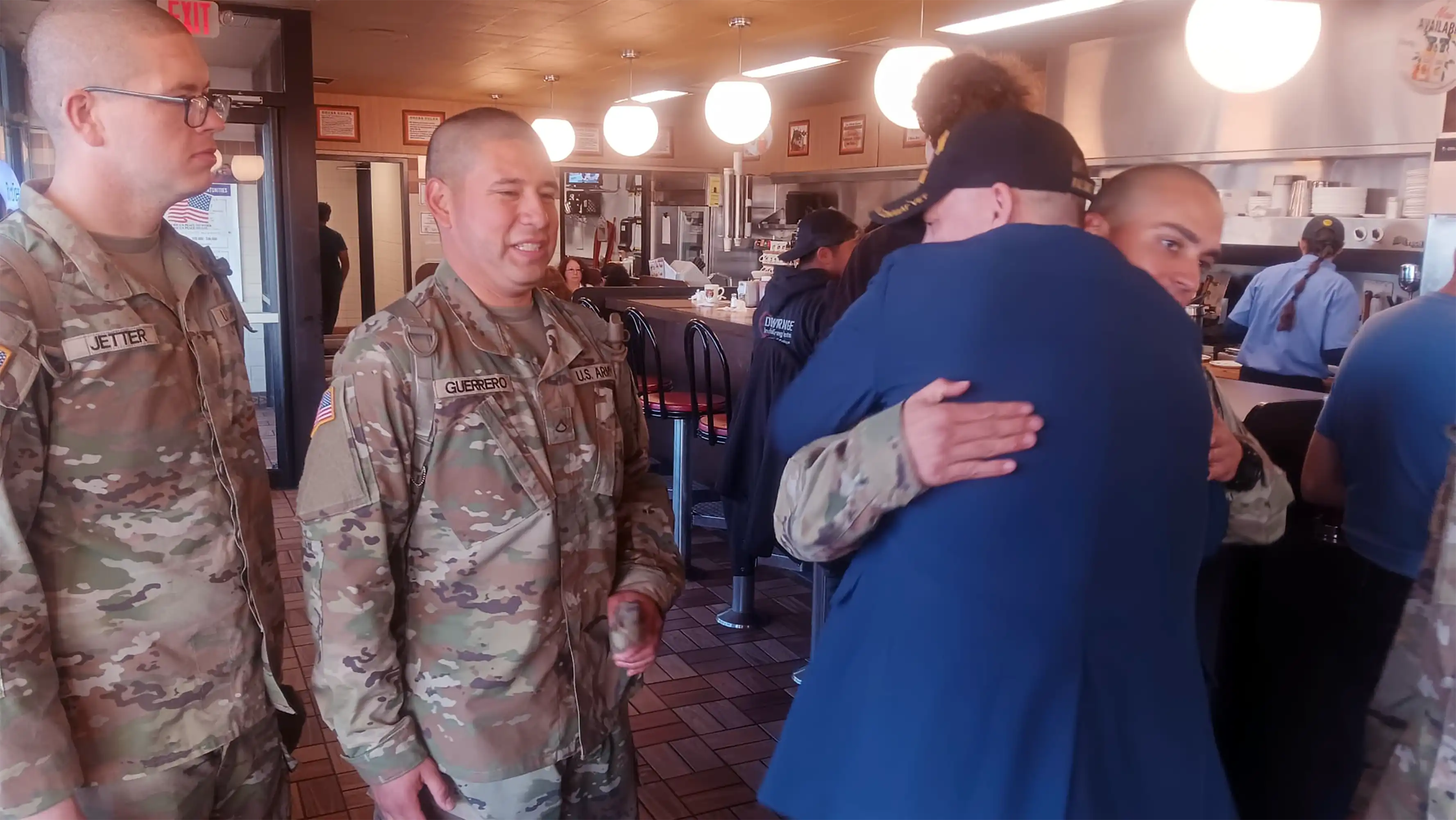 Great respect for soldiers graduating, Veteran David Haave gives that special hug at a Waffle House.